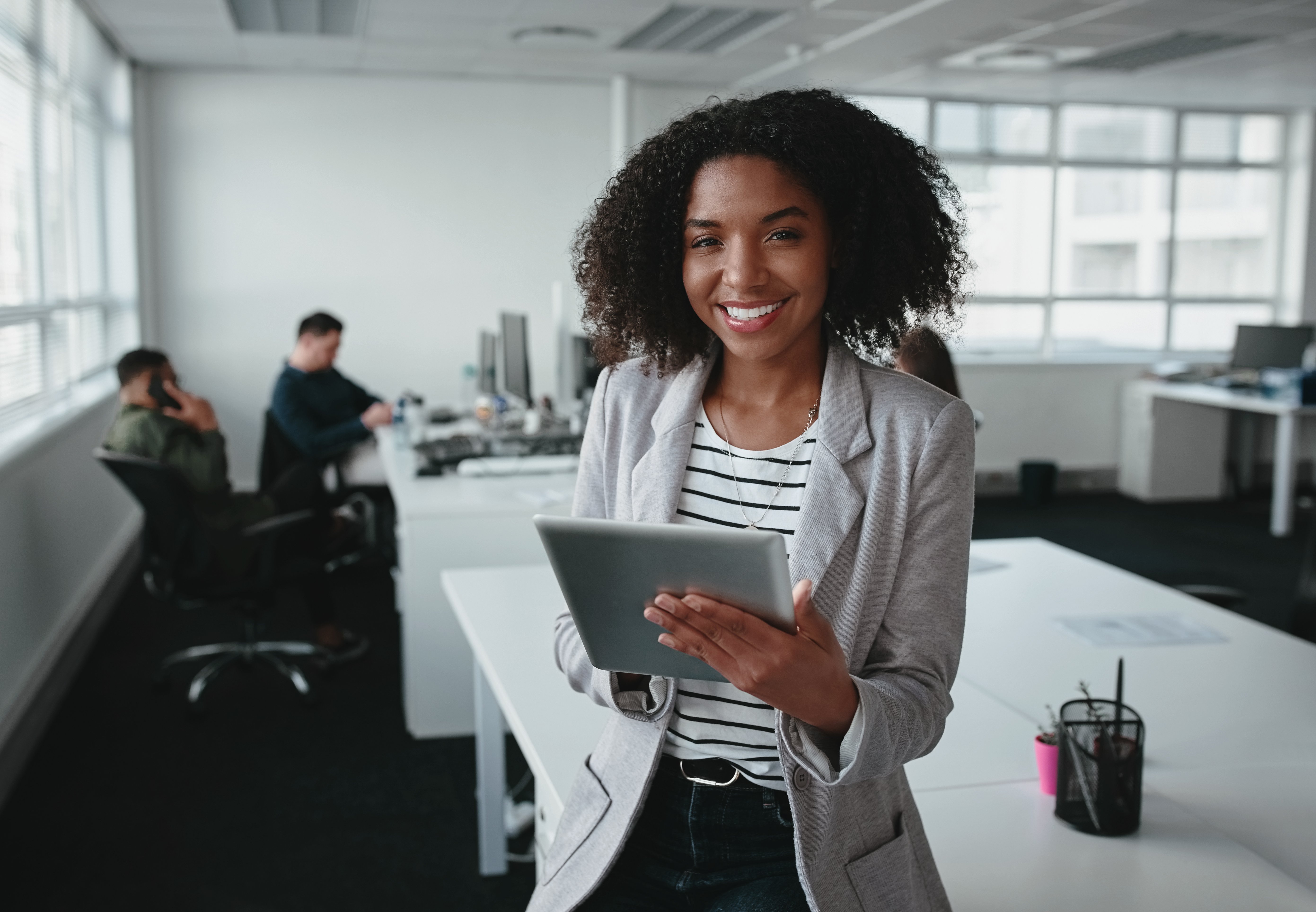 Human resources executive holding a tablet