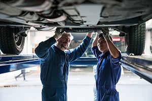 Working on car undercarriage