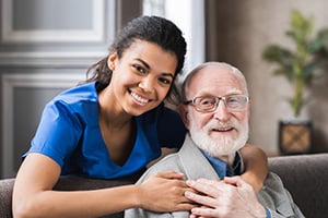 Smiling healthcare worker with patient