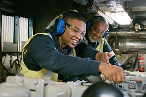 Mentor and mentee at manufacturing plant