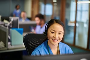 Young healthcare professional working at computer