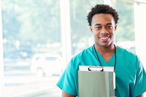 Young male healthcare professional with file